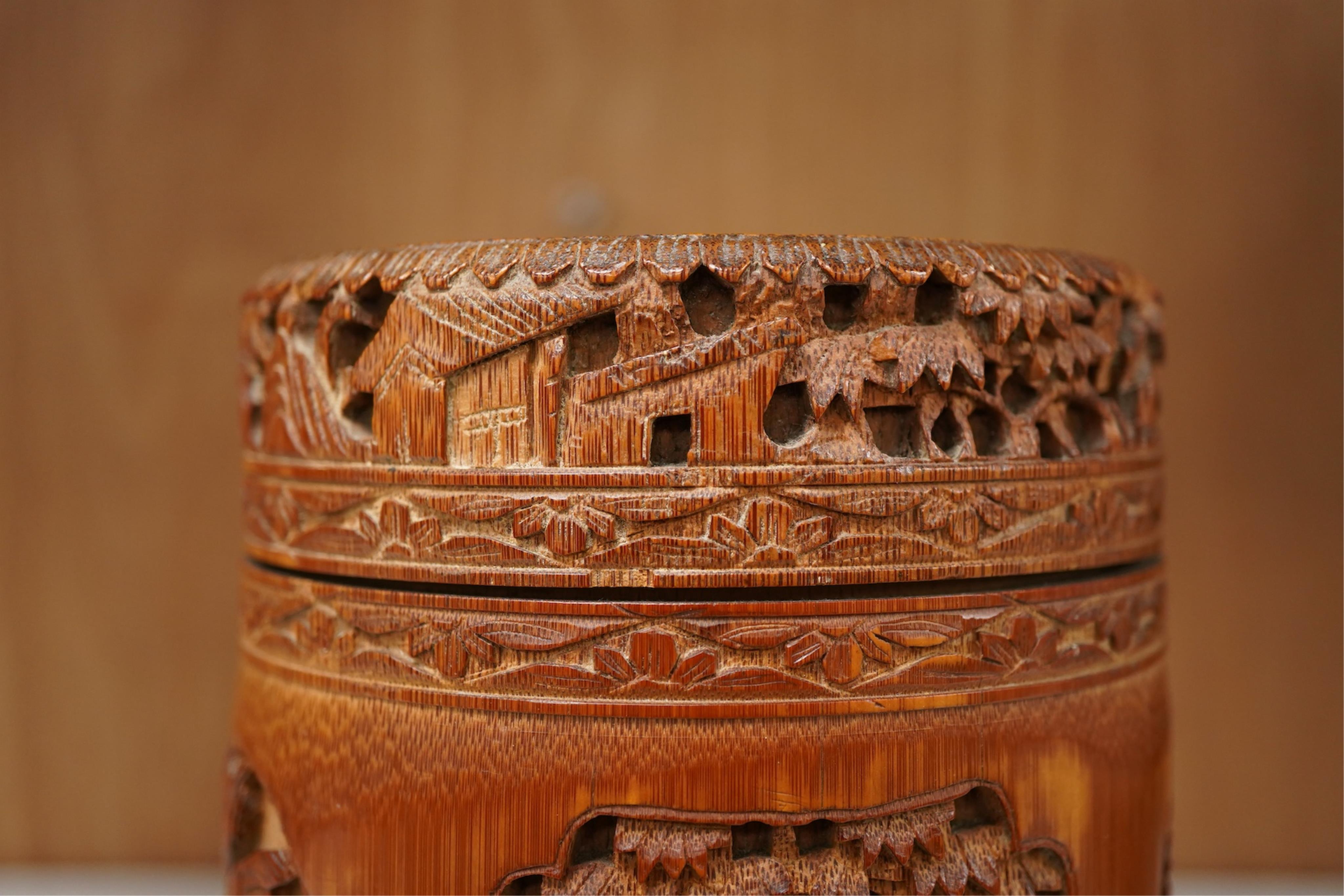 A Chinese carved bamboo tobacco jar and cover, 15cm high